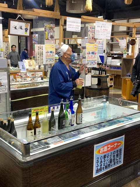 Kobe: Sake Brewery Tour with Tasting and Kobe Beef Bites - Motomachi Shopping Street and the fruit drink