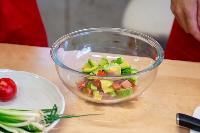 Osaka Home Feast Cooking and Sake Experience - Preparing chicken with green onion, mayo, and ponzu