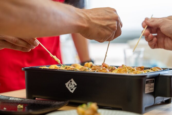 Osaka Home Feast Cooking and Sake Experience - Shopping for takoyaki ingredients in Minamimorimachi