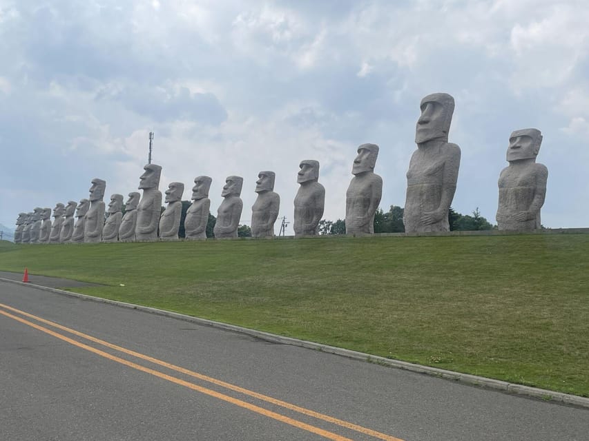 Sapporo: Buddha Hill, TV Tower, and Sake Stand Bar Tour - Moai statues and a Stonehenge replica